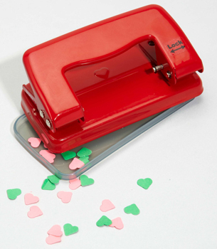 a heart-shaped hole punch. - Design For Mankind