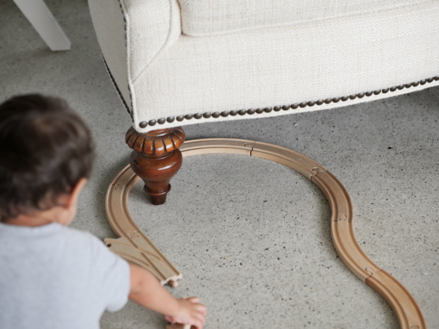 boy playing with toy train
